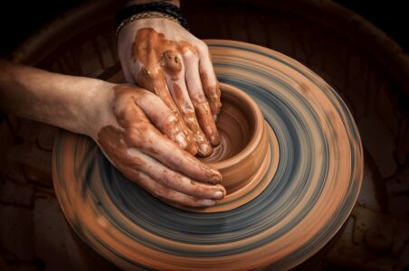 potters wheel and hands